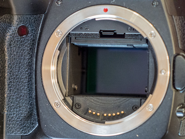 The full frame sensor of the Canon 5D is much larger than APS-C sized DSLR's.