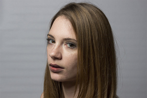 Shadows a little deeper. Facial features and skin texture much more defined. But still slightly soft transition zones.